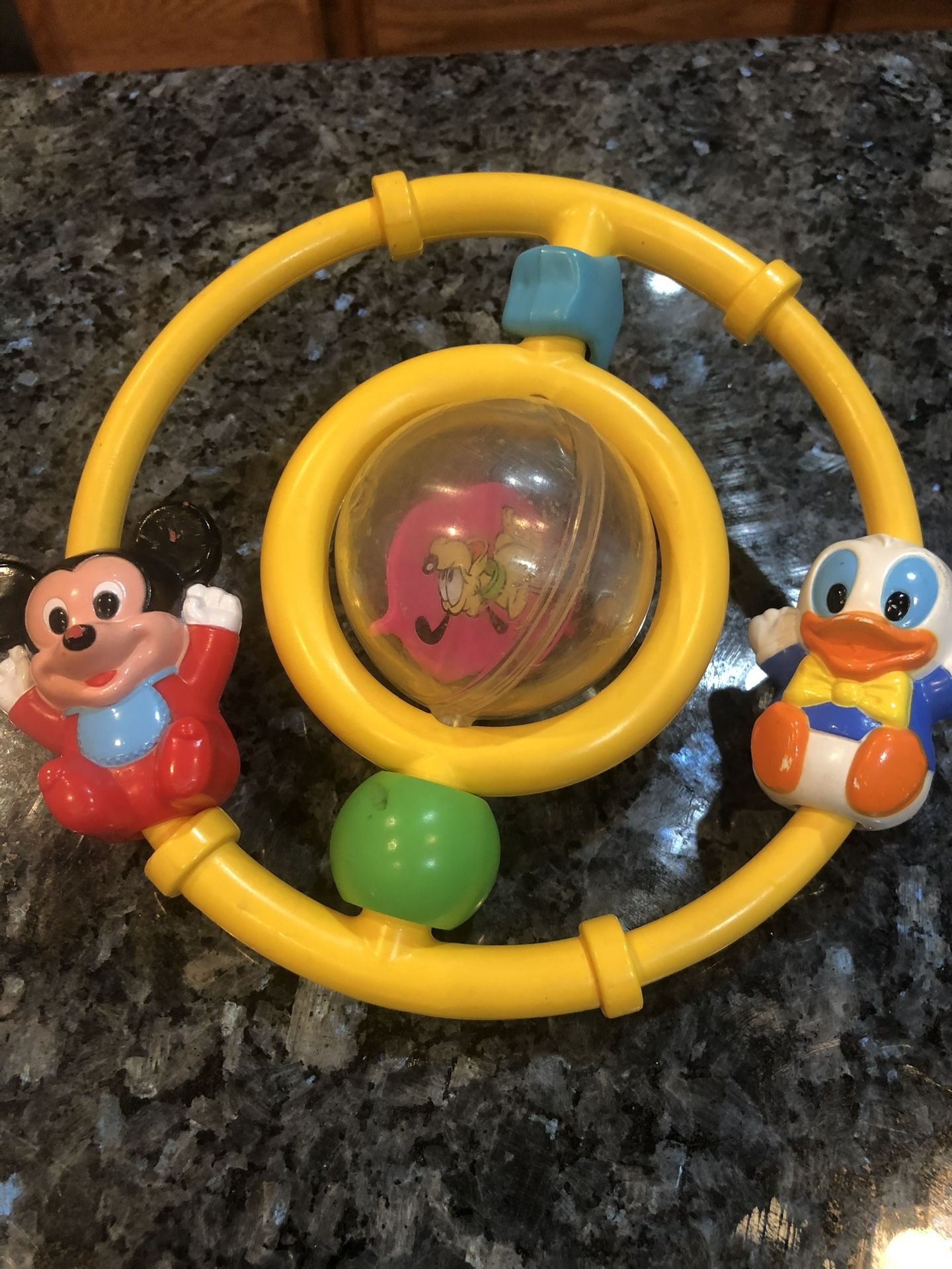 Vintage Disney Babies 1980’s Toys Rattle with Mickey Mouse, Donald Duck And Pluto.  Size 6 1/2 inches wide.  Preowned good condition.  Has been on dis