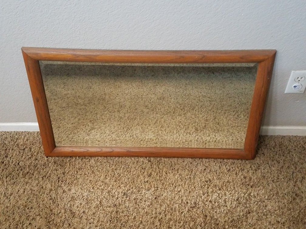Mirror with light wood frame