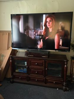 75 in sharp TV &  dark wood cabinet