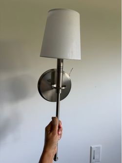 Set of 2 brushed nickel wall sconces.