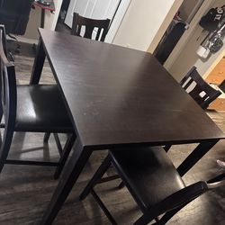 Four piece dining table