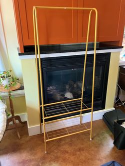 Clothing rack with hanger and shelves