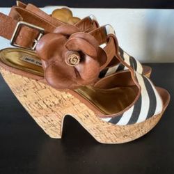 Brand new unused ladies, size 10 cork heels with strap.