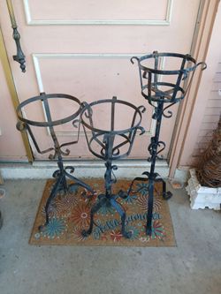 Vintage wrought Iron plant holders.