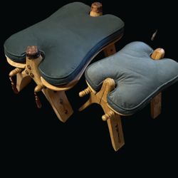 A pair of vintage hand-carved wooden camel saddle footrests.