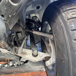 2017-2023 TESLA MODEL 3 KNEE ASSEMBLY / SUSPENSION FRONT DRIVER LEFT SIDE