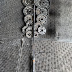 Olympic weights 255lbs total plus 7ft 45lbs bar