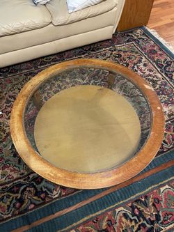 Circular wood and glass coffee table