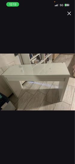 White vanity table with glass top