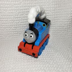 Thomas and friends train lights up and talks. Tested works . Measures 6 1/2" L X 8" T .