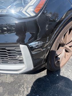 Black SUV Front Bumper Corner with Scratches
