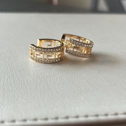 Versace style gold-plated hoop earrings with a Greek Key pattern and clear rhinestones