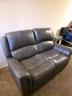 Brown Leather reclining love seat