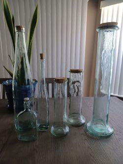 7 decorative glass canisters with lids