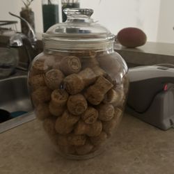 Acrylic Clear Apothecary Cookie Jar filled with Prosecco corks