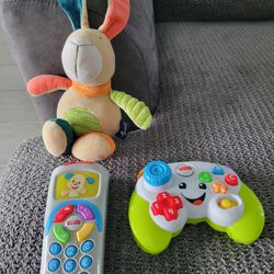 Fischer Price Light Up Talking Video Game Controller And A Musical Rabbit And A Fisher Price Remote Control