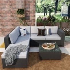 Blasa 4-Piece Rattan Sofa Seating Group with Cushions + Matching Storage Case