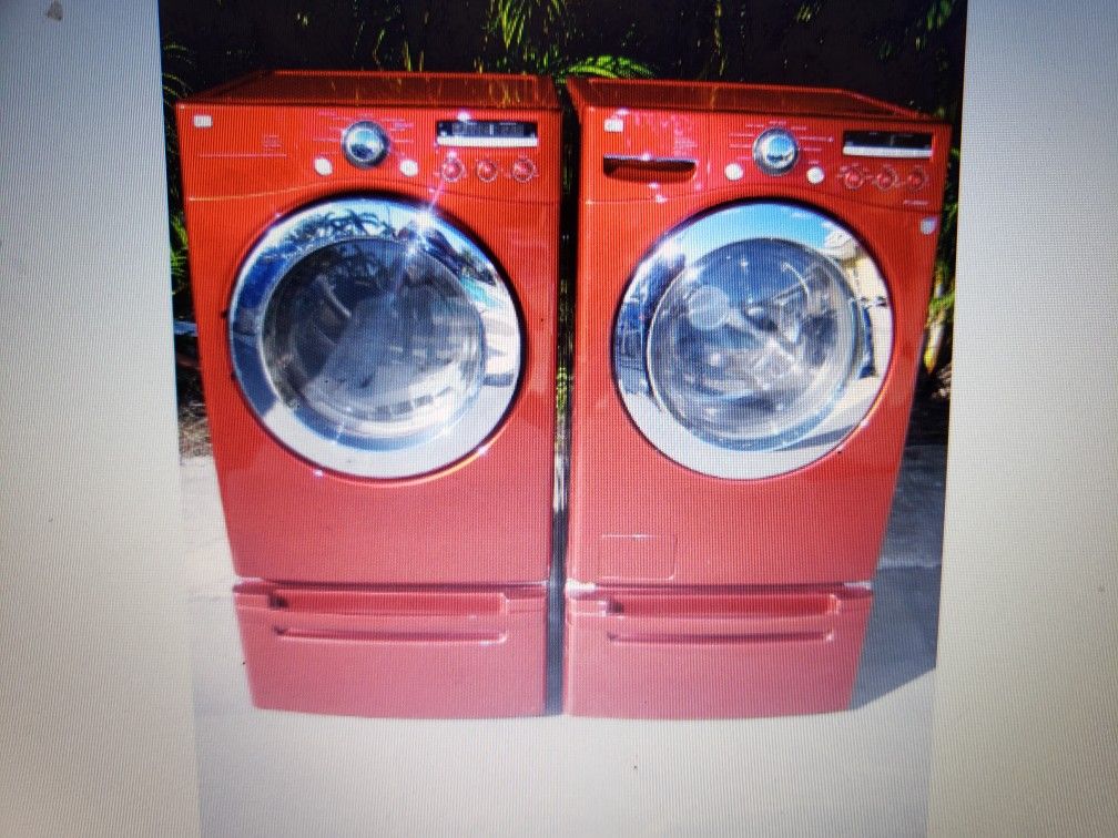 LG RED WASHER AND ELECTRIC DRYER SUPERCAPACITY WITH PEDESTALS