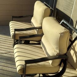 Two Outdoor Swivel Chairs and Covers