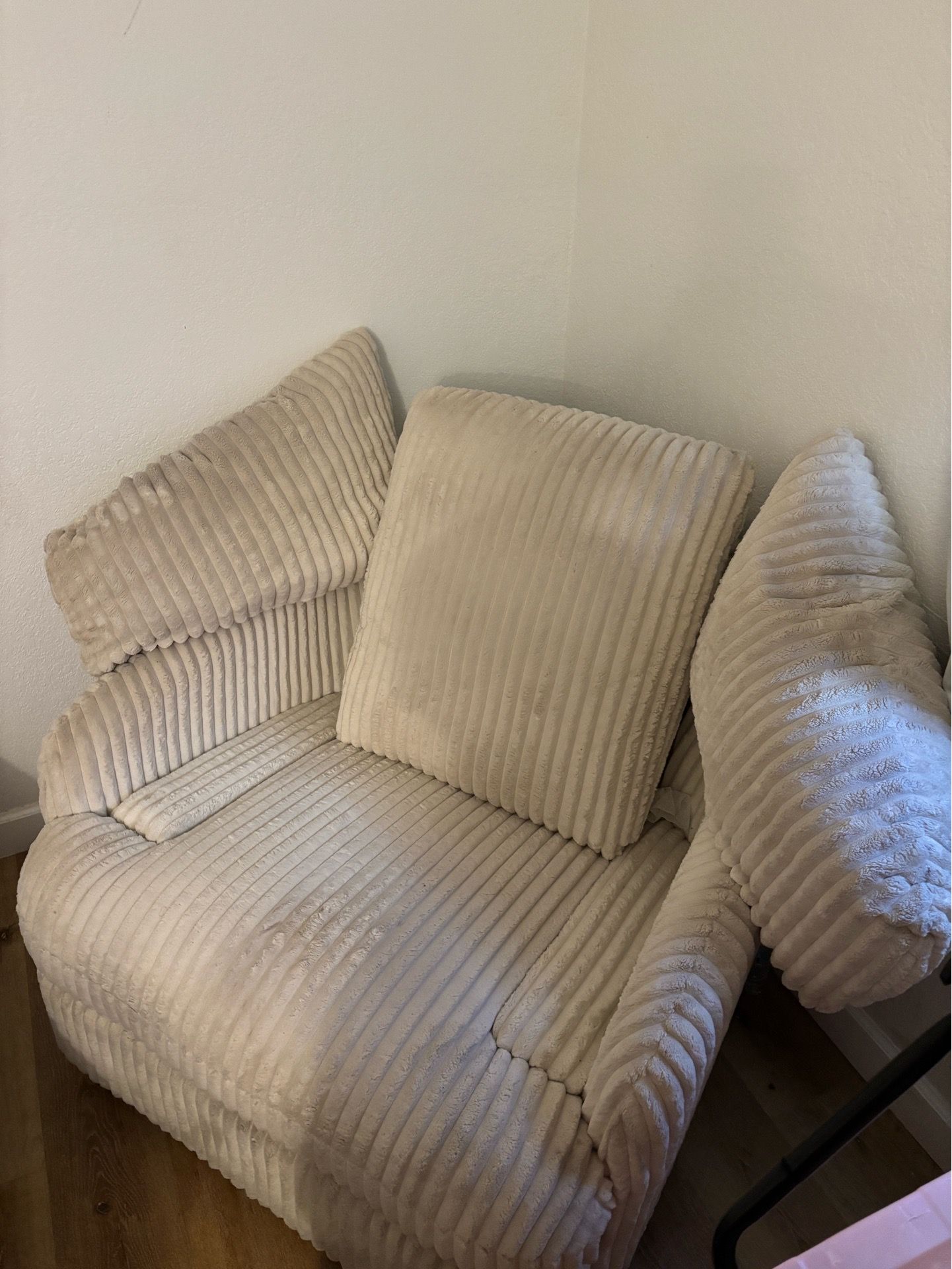 Cozy beige ribbed armchair