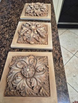 Set of 3 wood(?) Flowers carvings
