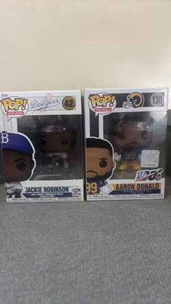 Jackie Robinson funko pop and  a Aaron Donald funko pop