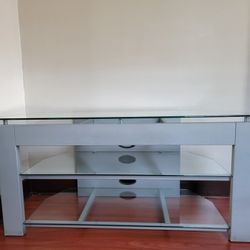 TV table/ TV stand.  Corner or wall TV table with three removable glass shelves. 
