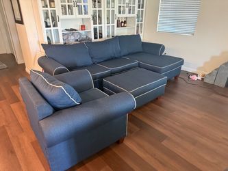 Sectional couch , storage ottoman, and chair set