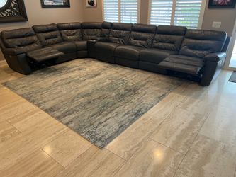 Dark Grey Leather Sectional . Seats can be reconfigured to be longer or shorter on either side.