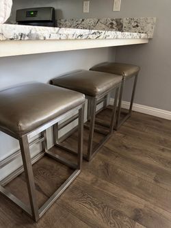 3 grey stools
