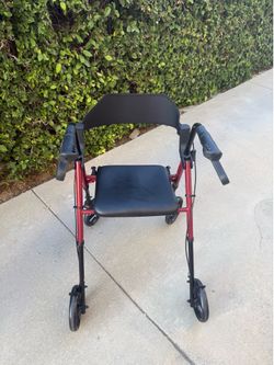 Like New Portable Walker with seat and storage