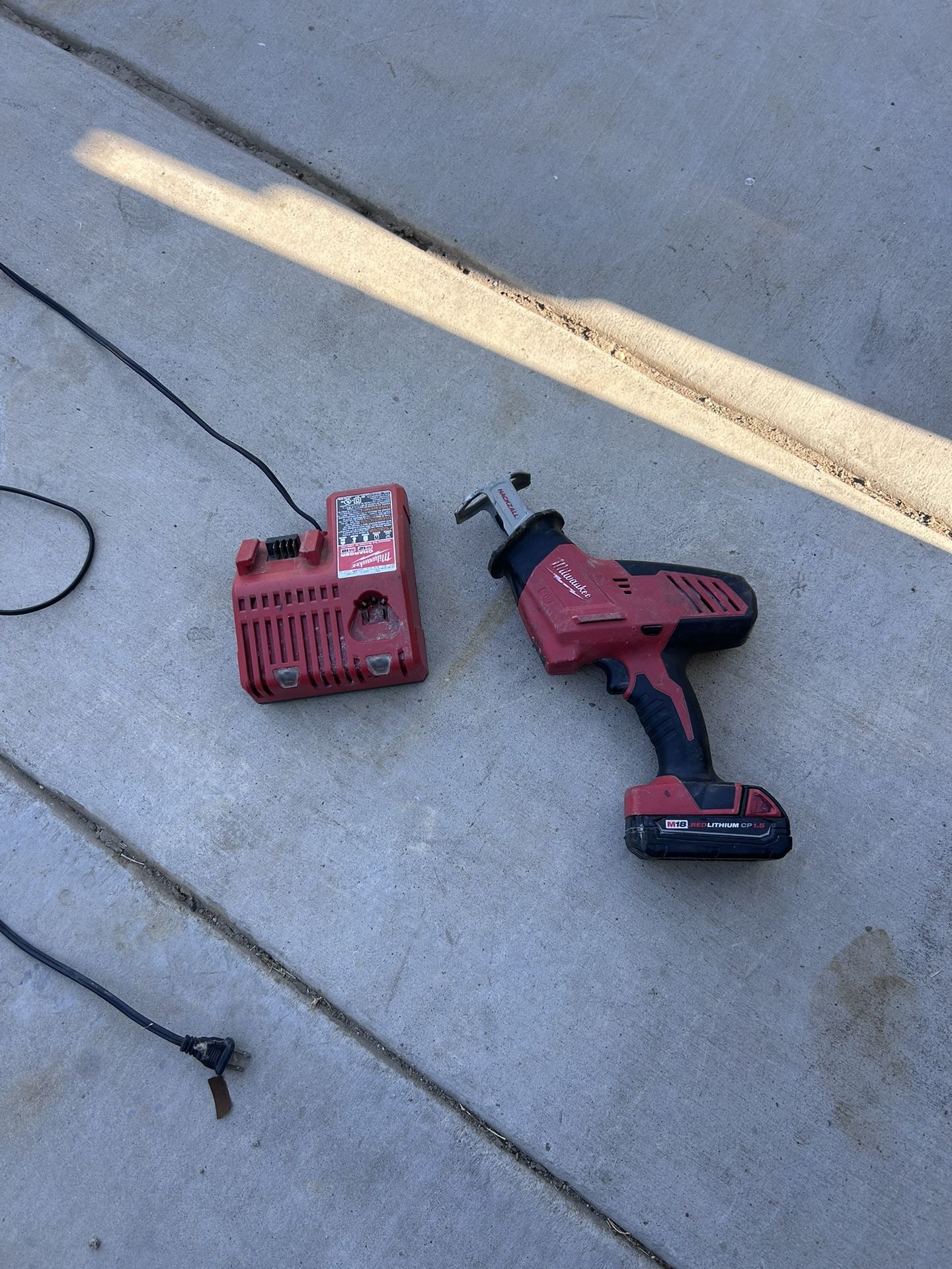 Milwaukee Saw Tool And Chager Only