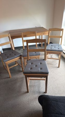 IKEA table with chairs .
