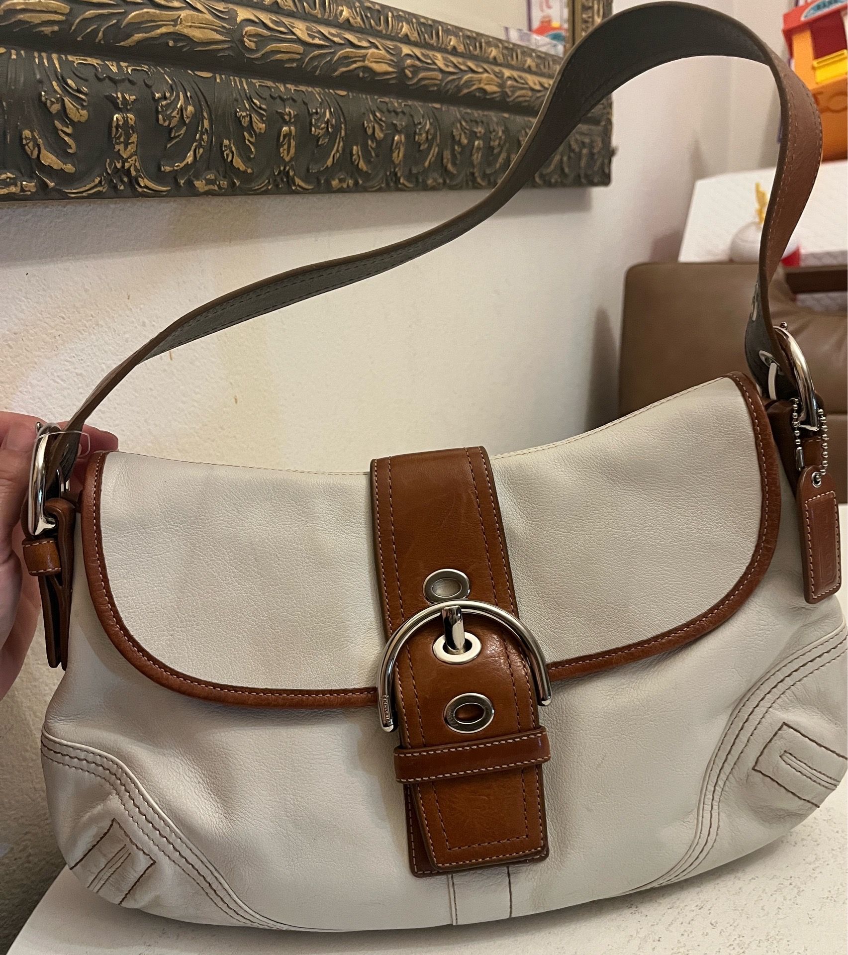 vintage white Coach Soho leather shoulder bag featuring a tan 