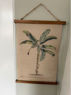 Palm tree hanging art prints on burlap