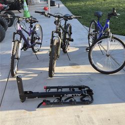 Three mountain bikes & bike rack