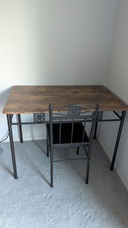 Wooden dining table with 4 cushioned chairs