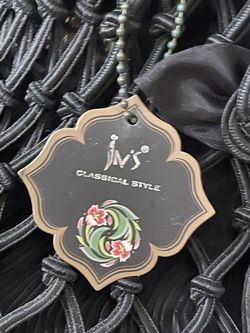 Black silky scarf over the wrist bag 