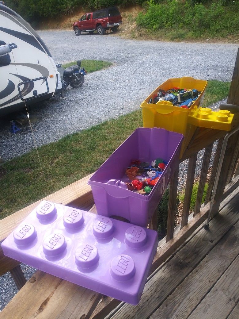Two LEGO bins. One Filled Near Overflowing, One w/ miscellaneous toys.