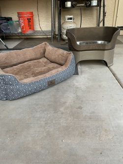 Dog Bed  And  Food  And  Water  Containers 