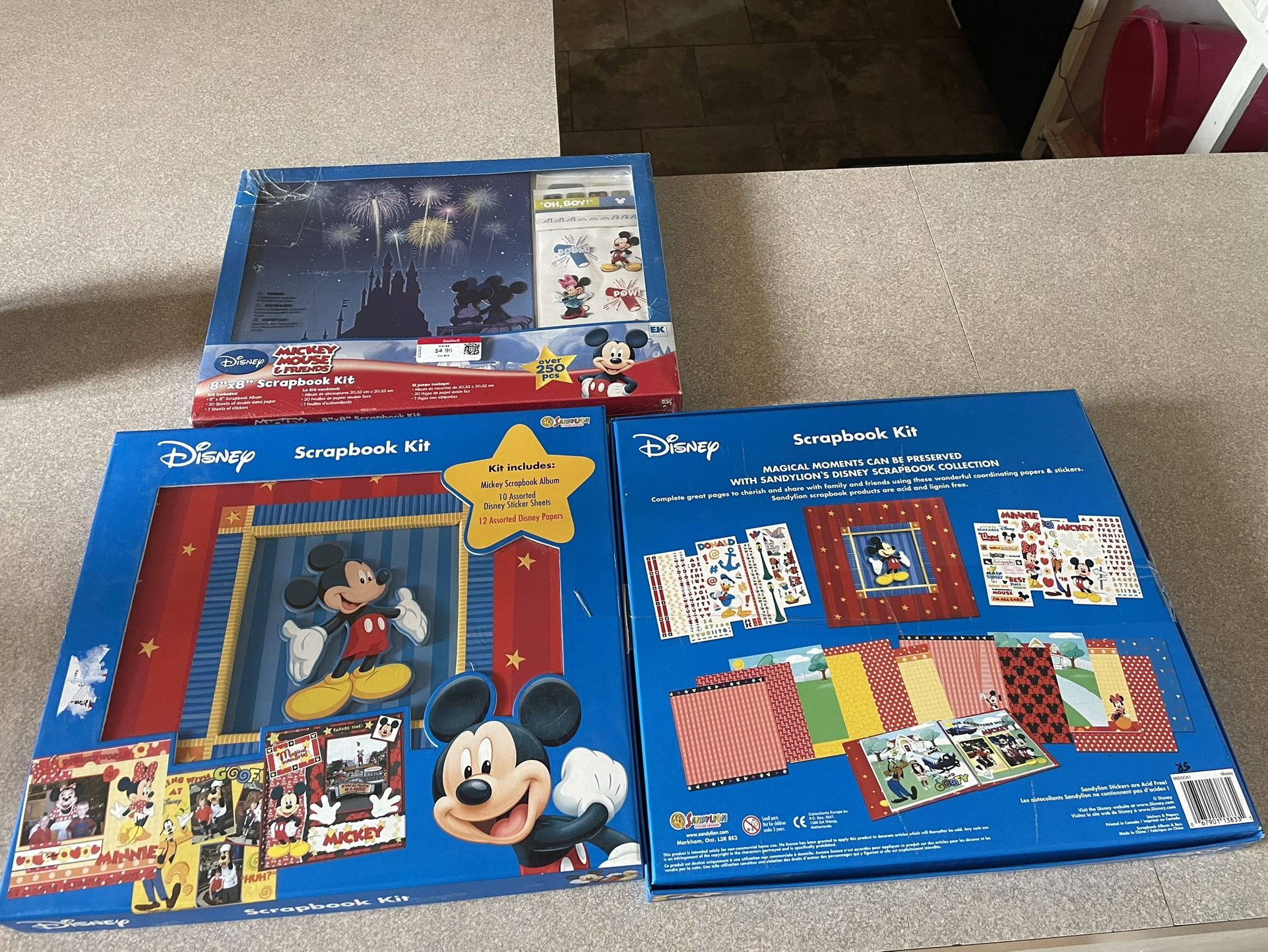 2 scrapbook kits and one scrapbook kit accessories