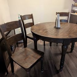 Rustic round wood dining table with 4
