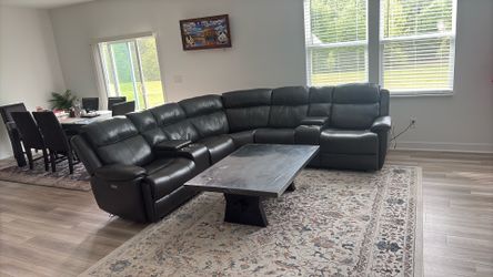 Sectional leather sofa with automatic recliner and coffee table