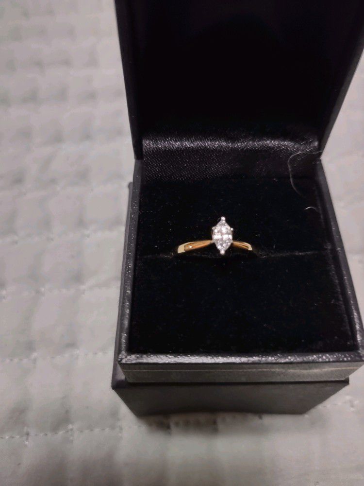 1/4 carrot marquis cut diamond ring. 10 carrot gold setting