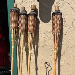 4 Tiki Torches And Fuel