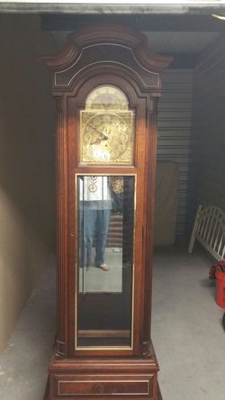 Howard Miller grandfather clock with all original paper