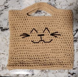 Hand crocheted cute and spacious animal face bag. Approximately 9" tall x 8" wide