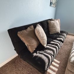 Futon/TV Console . Offers Welcomed