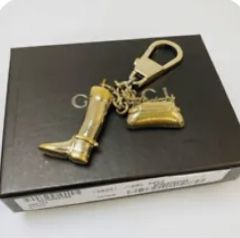 Original Boxed Gucci gold purse charm/keychain in great condition