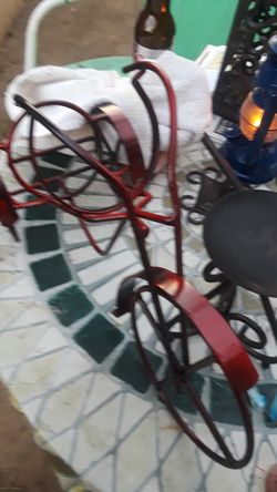 Rod iron tricycle to put your wine bottles on